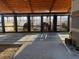 View of the horse barn featuring horse stalls, open beams, and horses inside at 195 Falcon Ln, Rougemont, NC 27572
