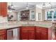 This kitchen features granite countertops, stainless steel appliances and views to other rooms at 195 Falcon Ln, Rougemont, NC 27572