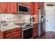 Well-equipped kitchen with stainless steel appliances and granite countertops at 195 Falcon Ln, Rougemont, NC 27572