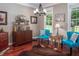 Cozy living room with wood floors and large windows at 195 Falcon Ln, Rougemont, NC 27572