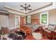 Spacious bedroom with a sliding barn door to bathroom, natural light, and wood floors at 195 Falcon Ln, Rougemont, NC 27572