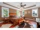 This main bedroom features tray ceilings, natural light, and wood flooring at 195 Falcon Ln, Rougemont, NC 27572