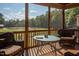 Relax on the screened porch with views of the horse pasture from this outdoor space at 195 Falcon Ln, Rougemont, NC 27572