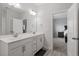Bright bathroom featuring double sinks, modern fixtures, and a clean design, perfect for a refreshing start at 204 Cassada Ct, Holly Springs, NC 27540