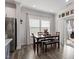 Cozy dining area with wooden table, seating, and a sliding glass door leading to outdoor space at 204 Cassada Ct, Holly Springs, NC 27540
