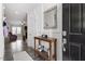 Stylish entryway with console table, mirror, and decorative details, leading into the living space at 204 Cassada Ct, Holly Springs, NC 27540