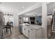 Open-concept kitchen with island, stainless steel appliances, and a seamless flow to the living area at 204 Cassada Ct, Holly Springs, NC 27540