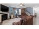 Comfortable living room with a fireplace, plush seating, and stylish decor for relaxation at 204 Cassada Ct, Holly Springs, NC 27540