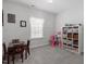 Bright playroom with a window, table, and shelves for organized storage at 204 Cassada Ct, Holly Springs, NC 27540