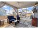Relaxing screened porch with comfortable seating, ceiling fan, and backyard view, perfect for outdoor enjoyment at 204 Cassada Ct, Holly Springs, NC 27540