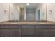 Bathroom features a double sink vanity with granite countertop and modern fixtures at 210 Cason Dr, Gibsonville, NC 27249