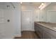 Bathroom featuring a granite countertop vanity, shower and wood-look flooring at 210 Cason Dr, Gibsonville, NC 27249