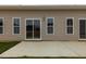 Back exterior view of home with a concrete patio and sliding glass doors at 210 Cason Dr, Gibsonville, NC 27249