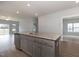 Spacious kitchen island with granite countertops, stainless steel dishwasher, and open view to the living area at 210 Cason Dr, Gibsonville, NC 27249