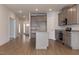 Open-concept kitchen with a center island, granite countertops, stainless appliances, and ample cabinet space at 210 Cason Dr, Gibsonville, NC 27249