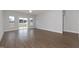 Spacious living room featuring wood-look flooring, ceiling fan and lots of natural light at 210 Cason Dr, Gibsonville, NC 27249