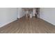Open floor plan view of living room and kitchen featuring wood-look flooring at 210 Cason Dr, Gibsonville, NC 27249
