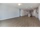 Open floor plan view of living room, kitchen and dining areas with modern flooring and recessed lights at 210 Cason Dr, Gibsonville, NC 27249