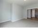 Carpeted living room with neutral paint and a view of the kitchen at 210 Cason Dr, Gibsonville, NC 27249
