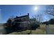 Beautiful home featuring classic brickwork, complemented by surrounding greenery and mature trees at 2200 N Nc 49 Hwy, Burlington, NC 27217