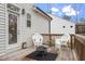 Cozy back deck with seating, perfect for relaxing outdoors with space for a fire pit at 228 Sacred Fire Rd, Louisburg, NC 27549