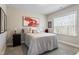 Cozy bedroom with decorative bedding, small speaker, and a painting hanging above the bed at 228 Sacred Fire Rd, Louisburg, NC 27549