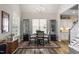 Bright dining room with classic chandelier, plenty of natural light, and modern furnishings at 228 Sacred Fire Rd, Louisburg, NC 27549