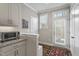 Kitchen space with exterior door, tile backsplash and stainless toaster oven at 228 Sacred Fire Rd, Louisburg, NC 27549