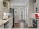Bright kitchen featuring granite countertops, stainless steel appliances, and hardwood floors at 228 Sacred Fire Rd, Louisburg, NC 27549