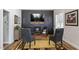 Stylish living room features a dark accent wall with fireplace, modern decor, and ample seating at 228 Sacred Fire Rd, Louisburg, NC 27549