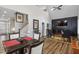 Open-concept design blends dining area and living space with a cozy fireplace and lots of natural light at 228 Sacred Fire Rd, Louisburg, NC 27549