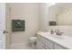 Well-lit bathroom featuring a vanity with storage, neutral walls and flooring, and modern fixtures at 2314 Wispy Green Ln, Raleigh, NC 27614