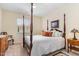 Traditional bedroom featuring a four poster bed, ceiling fan, and neutral walls and carpeting at 2314 Wispy Green Ln, Raleigh, NC 27614
