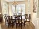 Traditional dining room with hardwood floors, chandelier, and large windows providing natural light at 2314 Wispy Green Ln, Raleigh, NC 27614