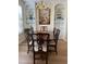 Elegant dining room with hardwood floors, built-in cabinets, and a beautiful chandelier at 2314 Wispy Green Ln, Raleigh, NC 27614