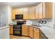 Lovely kitchen featuring stainless steel appliances, granite counters, and updated subway tile backsplash at 2314 Wispy Green Ln, Raleigh, NC 27614