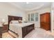 Spacious main bedroom features plush carpet, a tray ceiling, and a large window for natural light at 2314 Wispy Green Ln, Raleigh, NC 27614