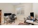 Office space featuring two computer workstations, neutral walls and carpeting, and natural light at 2314 Wispy Green Ln, Raleigh, NC 27614