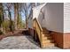 Backyard entrance showing a staircase and landscaped gravel and brick at 2506 Dominion St, Durham, NC 27704