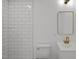 Modern bathroom with white subway tiles and gold fixtures at 2506 Dominion St, Durham, NC 27704
