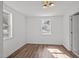 Bright bedroom with two windows and wood-look floors at 2506 Dominion St, Durham, NC 27704
