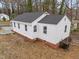 Exterior back view of a house with white siding and a dark roof at 2506 Dominion St, Durham, NC 27704