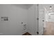 Hallway featuring clean walls, base trim, and laundry hookups at 2506 Dominion St, Durham, NC 27704