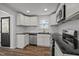 Newly renovated kitchen featuring granite countertops, stainless steel appliances, and stylish finishes at 2506 Dominion St, Durham, NC 27704
