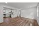 Bright living room features hardwood floors, white walls, and natural light from windows at 2506 Dominion St, Durham, NC 27704