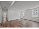 Spacious living room boasting hardwood floors, white walls, and ample natural light at 2506 Dominion St, Durham, NC 27704