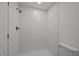 Clean white tiled shower with modern fixtures at 2506 Dominion St, Durham, NC 27704