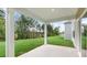 A covered patio that looks out onto a large yard with mature trees at 269 Umstead St, Sanford, NC 27330