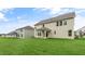 Spacious backyard with green grass and a view of the home's exterior at 269 Umstead St, Sanford, NC 27330