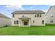 A large backyard and the rear elevation of the home features multiple windows for natural light at 269 Umstead St, Sanford, NC 27330